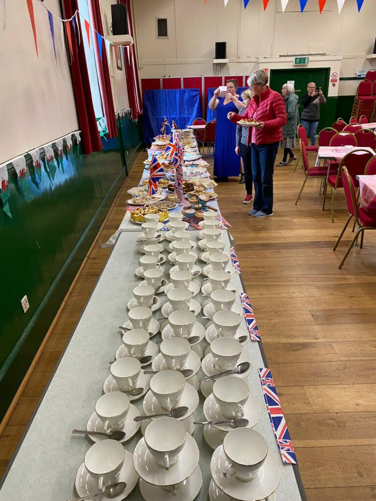 Large number of teacups laid out in Victoria hall for the Jubilee