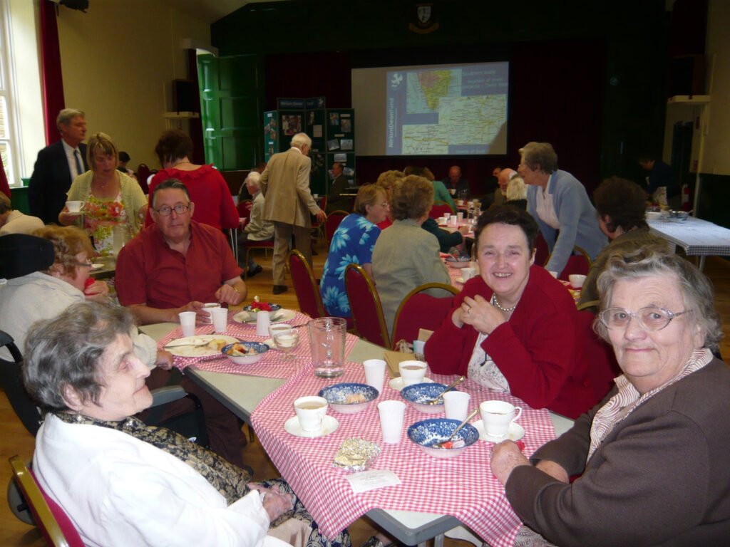 Group at a table in Victoria hall, Llanwrtyd wells